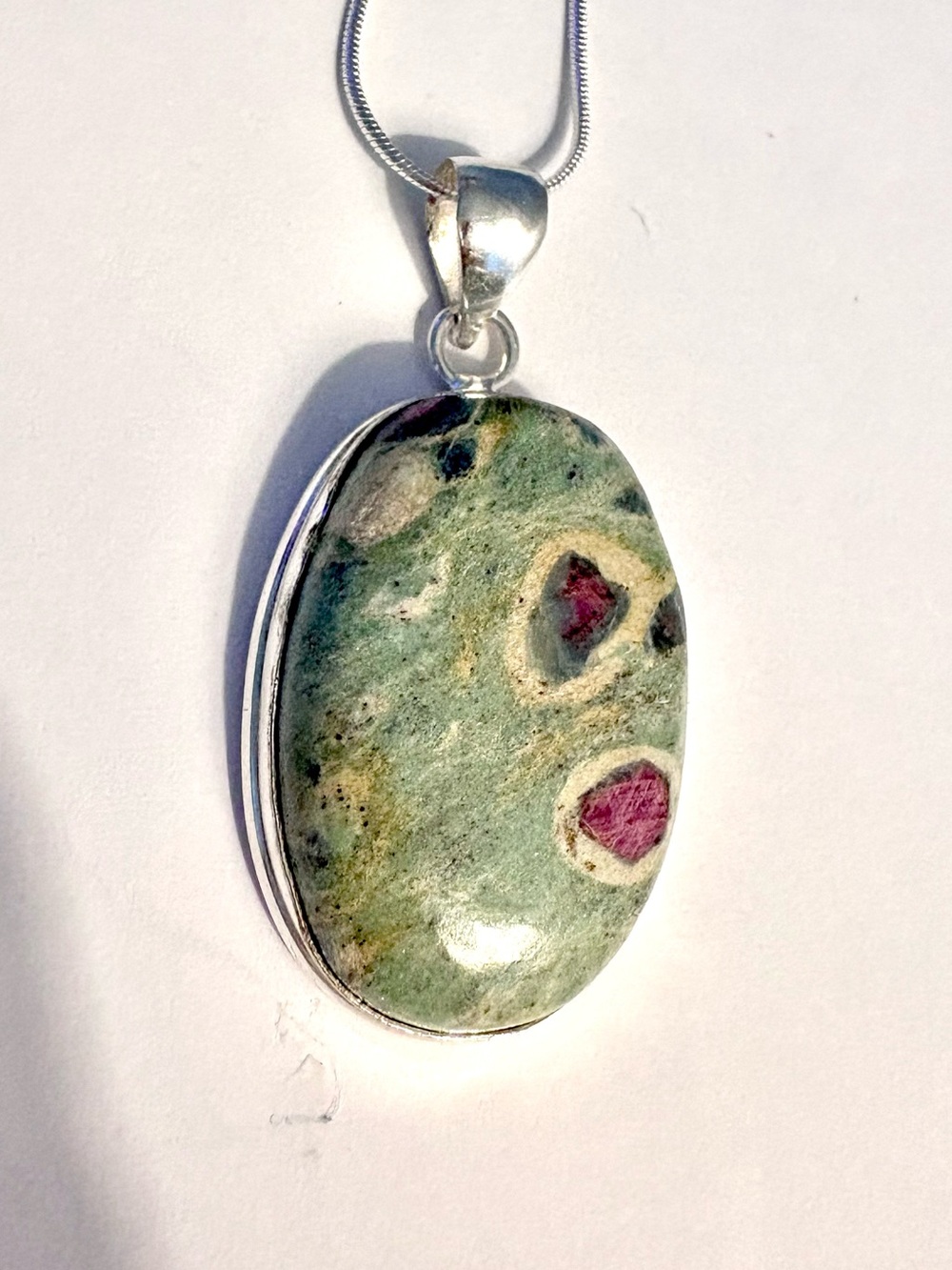 Beautiful, handcrafted, 2 inch Ruby Zoisite pendant on a silver chain.